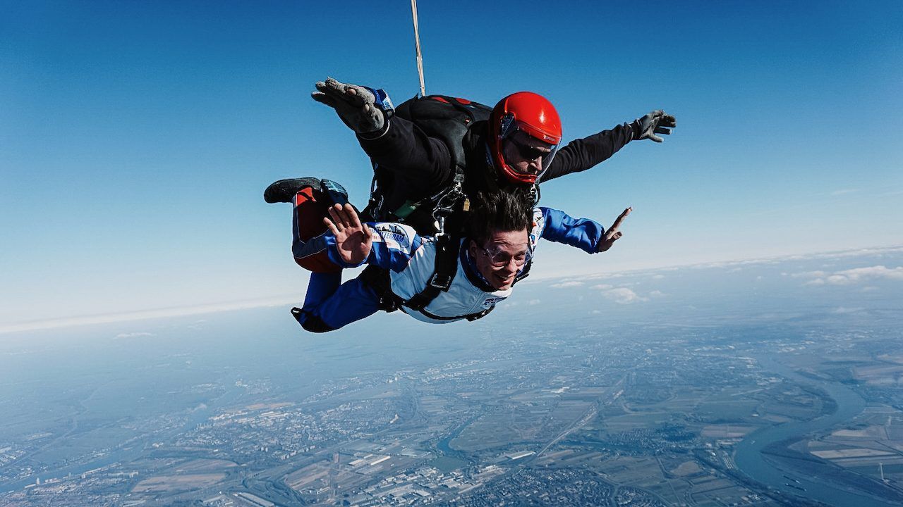 Polle on a tandem skydive high above the clouds